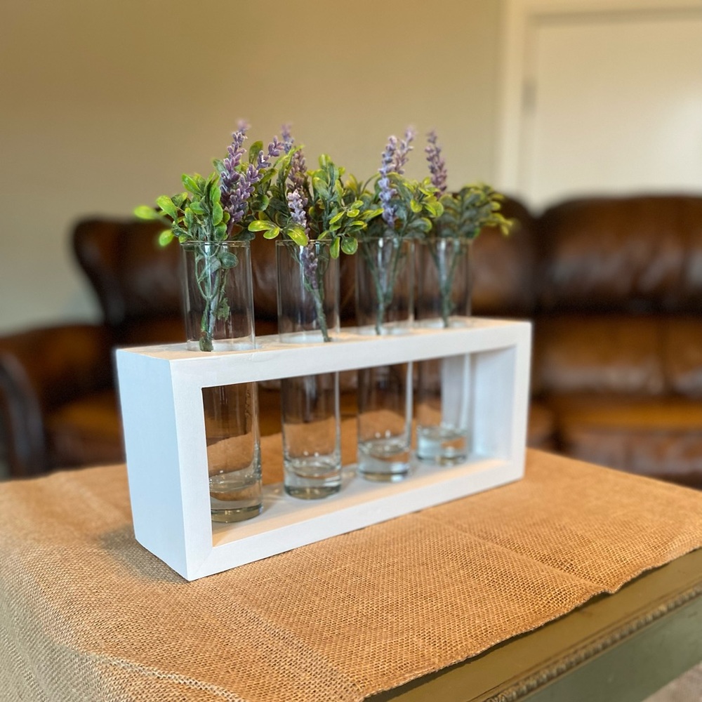 Home decor - wood stand with glass vases & greenery/flowers.